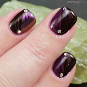 Half-and-half purple nail art.