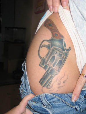 smoking gun tattoo. Gun Tattoos