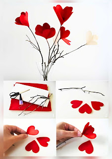 Ideias de decoração para o dia dos namorados centro de mesa com corações de papel em galhos