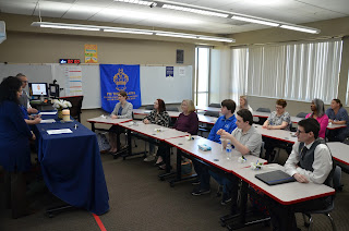 PTK induction ceremony. Background: Classroom setting decorated in Royal Blue and decorations for PTK