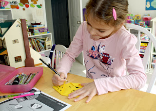 Tessa had a lot of fun with IFAW's "Animal Explorers: Dogs & Cats" activity booklet. She especially enjoyed making the simple origami dog on the last page.