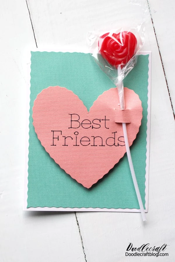 Use the Cricut Maker and Wavy Cut Blade to make conversation hearts inspired Valentine's day cards. This cute Valentine Card inspired by conversation hearts is easy to make using the Cricut Maker, drawing pen and the wavy cut blade. Insert a lollipop for the perfect Valentine's Day gift!