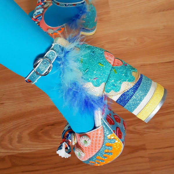 close up of dripping glitter platform and striped heel on doughnut themed shoes