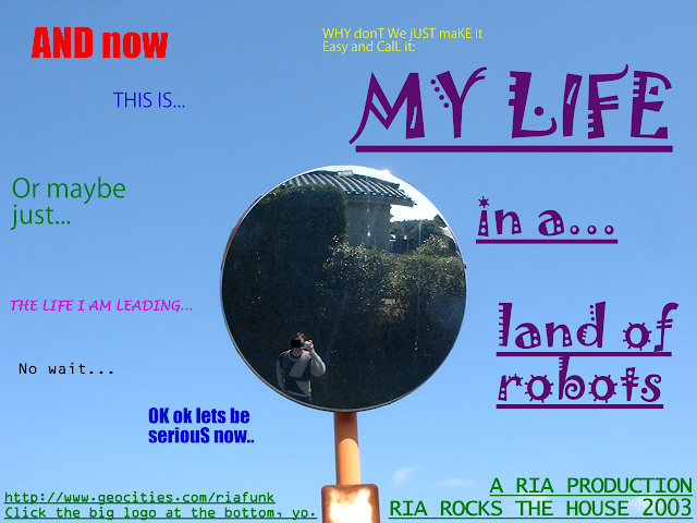 A photo of a round traffic mirror in Japan, with a blue sky in the background, and the reflection of a person standing in front of some bushes and a house, who is holding a camera up to take a picture of the traffic mirror.
