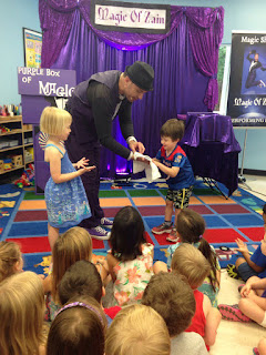 Zain performs magic for audience of kids parties entertainment in northern virginia schools.