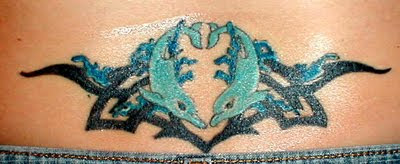 awesome tribal dolphin lower back tattoo