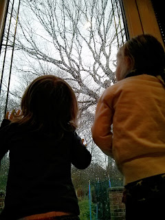 girls watching rain