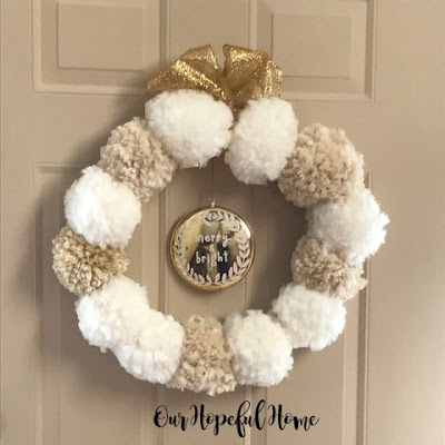 DIY yarn pom pom wreath Christmas Anthro-inspired