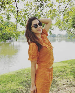 Mehreen Pirzada in Orange Dress with Cute Smile