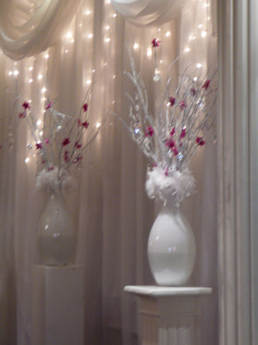 Original white vases twigs flowers and hanging crystals created an elegant 