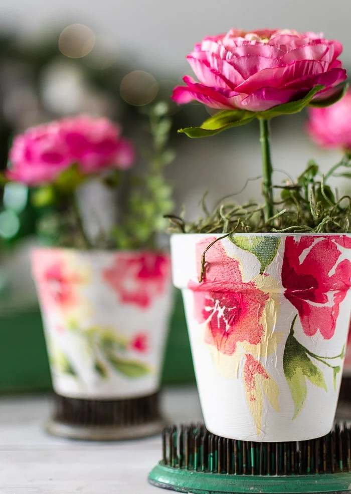 close up decoupage floral flower pots