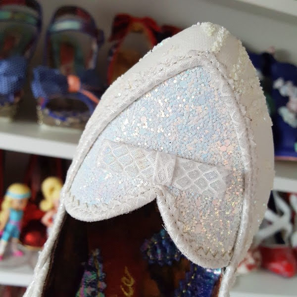 glitter heart shaped front of shoe with small bow