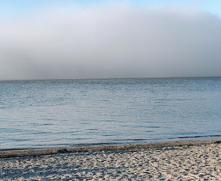 Land bridge at low tide w/ fog hiding island