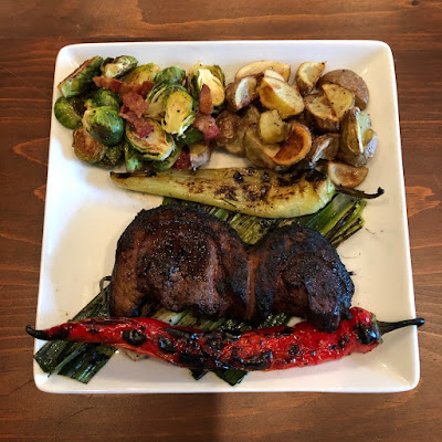 Grilled Picanha with leeks, chilies, roasted potatoes and bacon roasted Brussels sprouts
