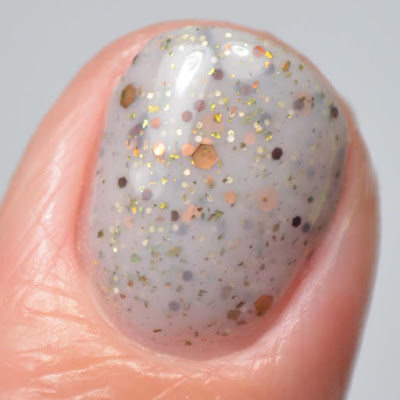 grey glitter nail polish close up swatch