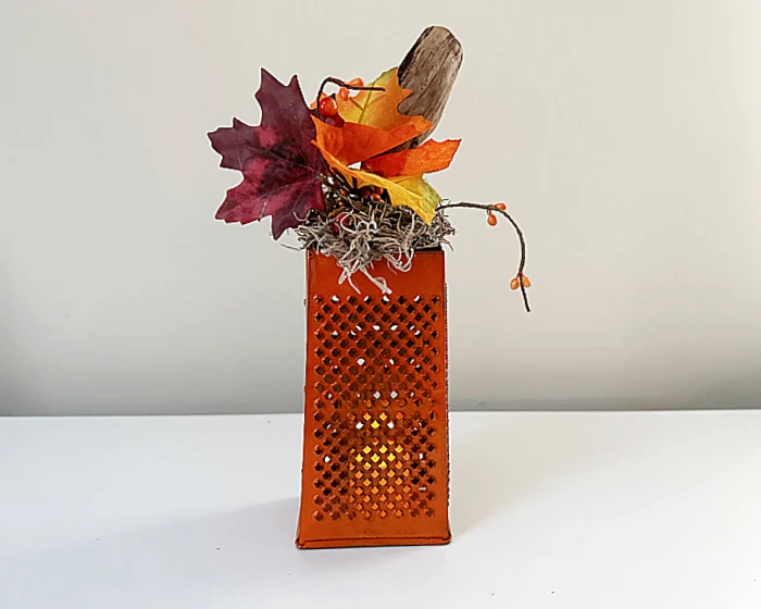 cheese grater lantern with a stem and leaves