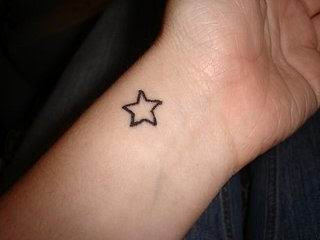 cute wrist star tattoo