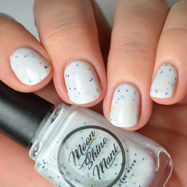 white crelly nail polish with assorted glitter swatch