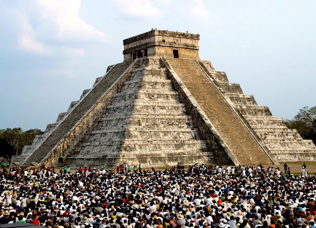 People gathering at the Mayan Ruins of Chichen Itza.