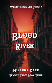 A book cover for Blood River, by Miranda Kate, Tricky's Tales Book Three. The tagline at the top is When Things Get Tricky. The picture depicts a canal of water between two rows buildings, similar to Venice, with boats parked along the sides. The filter over it is a dark red to coral red in the middle where the clear coral red sky reflects in the water, with the glimpse of orange yellow at the horizon like a sunset.