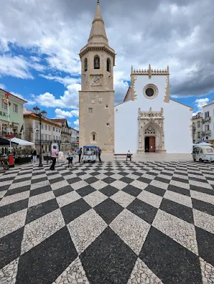 Igreja de São João Baptista and patterned tiles on Praça de República in Tomar Portugal