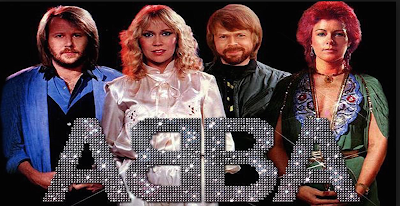 Pic of the four band members from ABBA in seventies glitter clothing