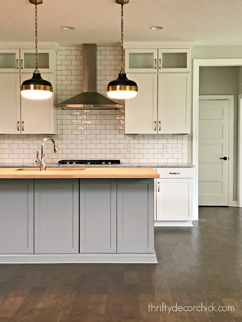 gray and white kitchen with white subway tile