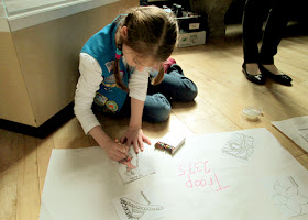 After touring the World's Fair exhibit, the girls colored "postcards" from various countries around the world and then taped them onto a sheet of butcher block paper to fashion a mini mural. Since Tessa was the only girl from her troop, she got a mural all to herself.