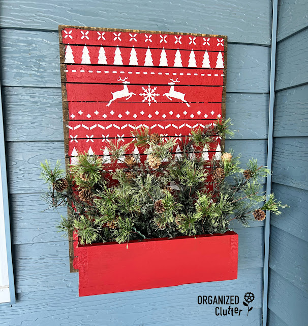 Photo of a Christmas Sweater stenciled Christmas Planter Box.