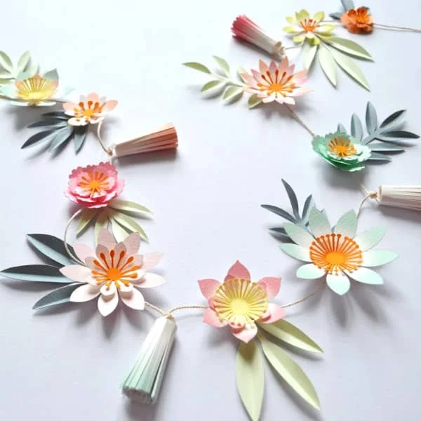 pastel flower garland with tassels and leaves