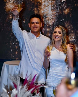 Gio Urshela with his wife Danna Delgado in their wedding dress