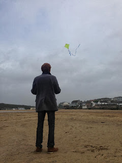 Flying a kite on the Cornish beach