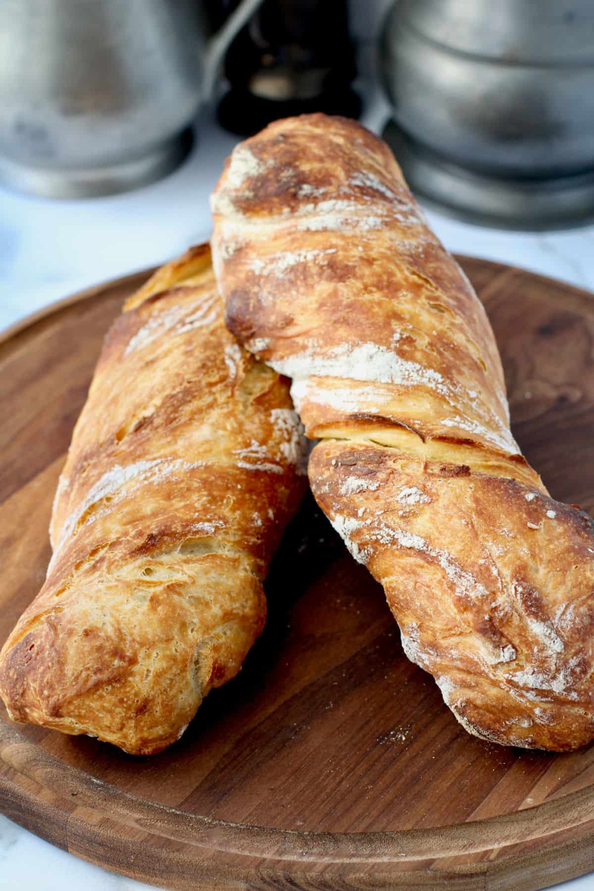 No Knead Durum Stirato loaves on cutting board.