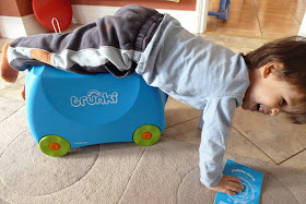 Child playing with new Trunki
