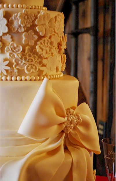 This cake was a deep champagne color and the bride wanted lots of lace 