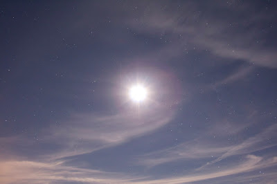 gibbous moon in clouds