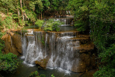 In the embrace of Huai Mae Khamin, one finds not just a waterfall but a sanctuary of tranquility