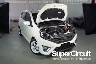 SUPERCIRCUIT Front Strut Bar installed to the Perodua Axia (pre-facelift model).