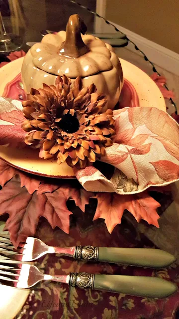 pumpkin soup tureens with leaves placemats
