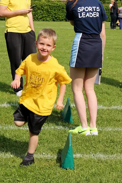 A boy taking part in a running race on sports day
