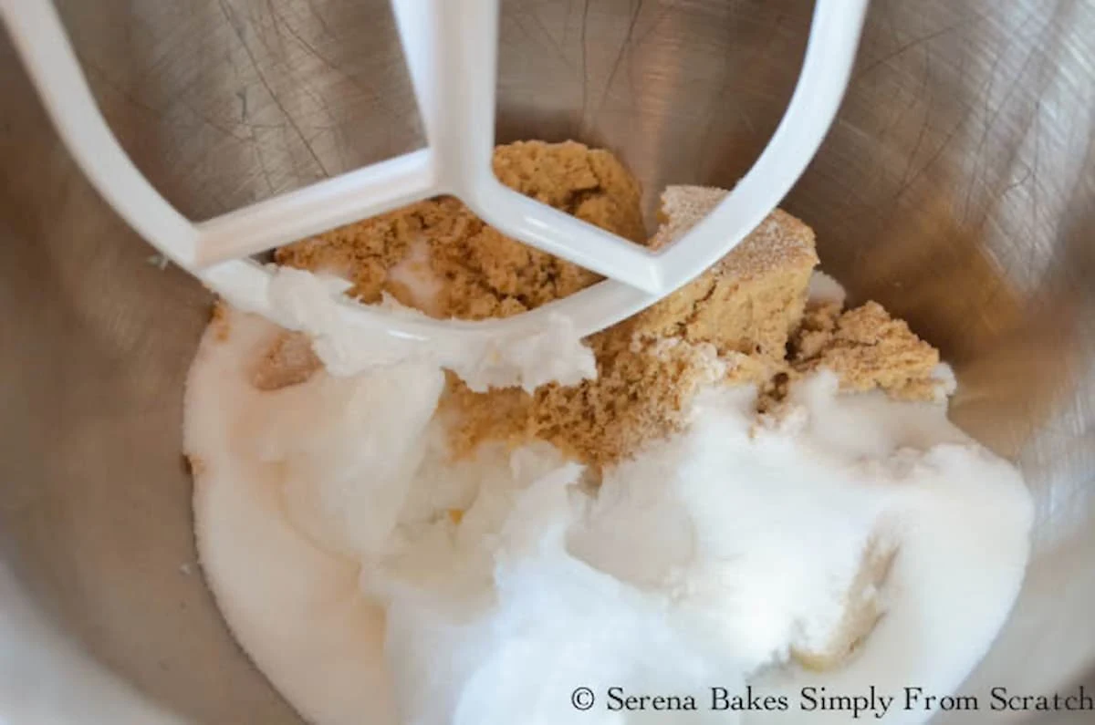 Brown Sugar, Granulated Sugar, and Coconut Oil in a stainless steel mixing bowl fitted with a mixing paddle.