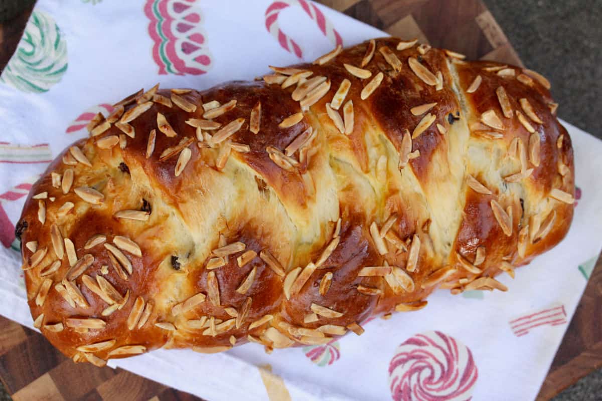 Czech Christmas Bread (Vánočka) sprinkled with slivered almonds.