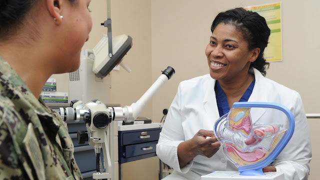 PENSACOLA, Florida (February 5, 2019 Lt. Cmdr. Leslye Green, staff obstetrician and gynecologist, Naval Hospital Pensacola (NHP), uses a model to discuss cervical cancer with a patient at NHP, Feb. 5, 2019. According to the Centers for Disease Control and Prevention (CDC), cervical cancer is highly preventable because screening tests for cervical cancer and vaccines to protect against human papillomavirus (HPV), which is the main cause of cervical cancer, are readily available. Cervical cancer is highly treatable and associated with long survival and good quality of life when it is found early. (U.S. Navy photo by Mass Communication Specialist 1st Class Brannon Deugan)