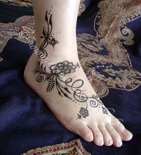 Flower foot tattoos