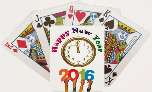Happy New year 2016 written on a blank card with other cards in the background
