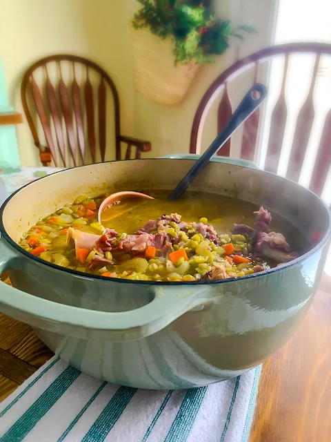 Hearty Split Pea Soup is made with a meaty hambone, generous carrots, onions, and celery, yielding a flavorful broth.  It is easy to make on the stovetop, but I have added a slow cooker and instant pot option.