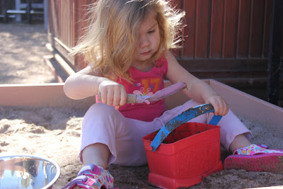 toddler in the sandbox