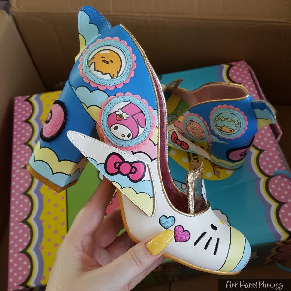 Hello Kitty plane shaped shoe being held in hand