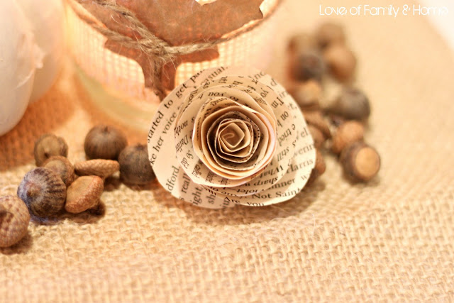 A single rose was also added to the tall glass cylinder with a few twigs 