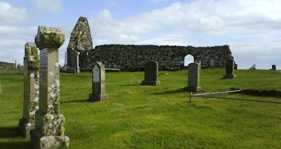 Ruined church surrounded by gravestones